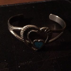 A silver and turquoise bracelet